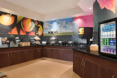 a bar in a restaurant with a drink counter at Fairfield Inn & Suites Youngstown Boardman Poland in Poland