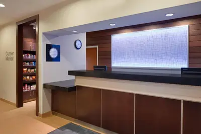 a bar in a room with a large window at Fairfield Inn & Suites Youngstown Boardman Poland in Poland
