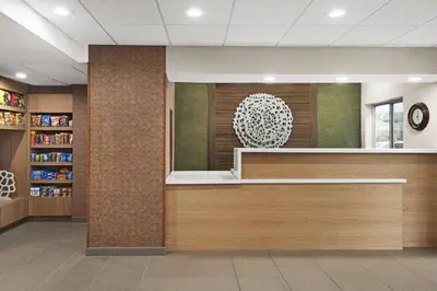 a lobby of a library with a reception desk at Fairfield Inn by Marriott Warren Niles in Warren