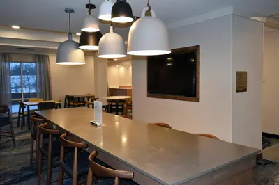 a conference room with a large table and chairs at Fairfield by Marriott Youngstown/Austintown in Youngstown