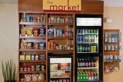a store with a refrigerator with food and drinks at Residence Inn Youngstown Boardman/Poland in Poland