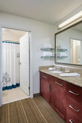 a bathroom with a sink and a mirror at Residence Inn Youngstown Boardman/Poland in Poland