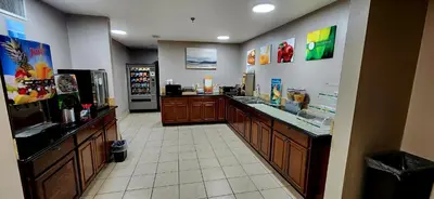 a restaurant with a food counter in a room at Quality Inn Brunswick Cleveland South in Brunswick