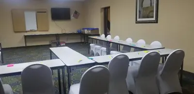 a room with rows of tables and chairs in a classroom at Quality Inn Brunswick Cleveland South in Brunswick