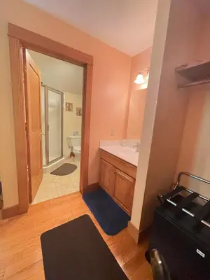 a bathroom with a sink and a mirror at Bodee's Bungalow Adults Only Couples Only Boutique Hotel in Put-in-Bay