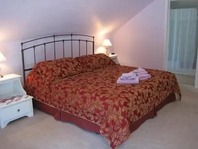 a bedroom with a bed with towels on it at Ahoy Inn Guesthouse in Put-in-Bay