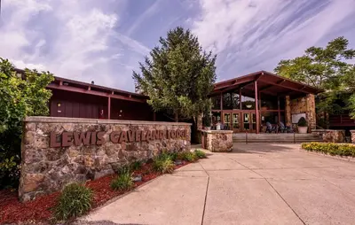 a building with a sign that reads lewis carpenter at Carter Caves State Resort Park in Olive Hill