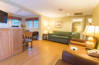 a living room with a couch and a table at General Butler State Resort Park in Carrollton