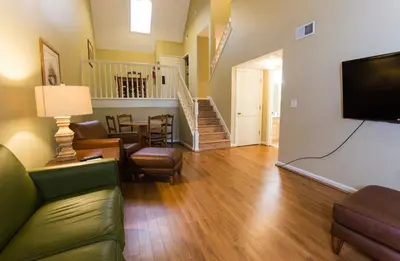 a living room with a couch and a flat screen tv at General Butler State Resort Park in Carrollton
