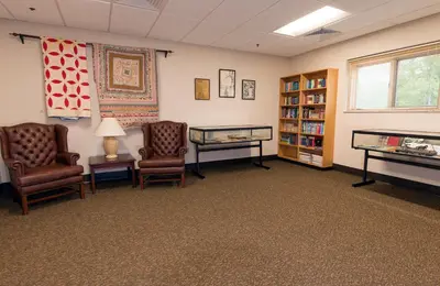 a waiting room with two chairs and a desk at Greenbo Lake State Resort Park in Argillite