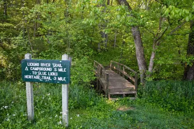 a wooden bridge with a sign in front of it at Blue Licks Battlefield State Park in Carlisle