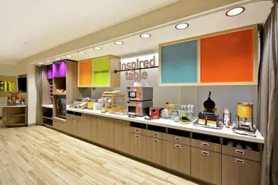 a restaurant with a kitchen with aasteryasteryasteryasteryasteryasteryasteryasteryastery at Home2 Suites by Hilton Perrysburg Levis Commons Toledo in Perrysburg