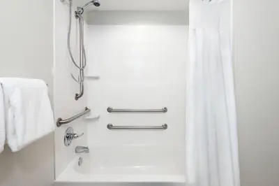 a bathroom with a shower with a shower curtain at Courtyard Fort Wayne Downtown at Grand Wayne Convention Center in Fort Wayne