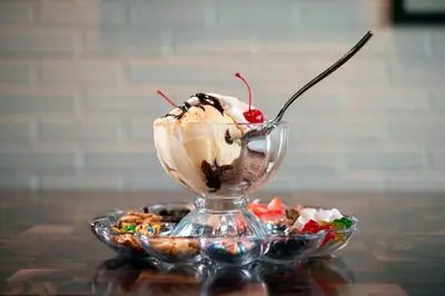 a ice cream sundae in a glass bowl on a table at Courtyard Fort Wayne Downtown at Grand Wayne Convention Center in Fort Wayne