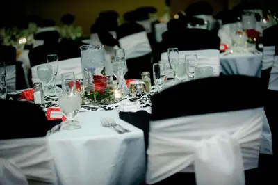 a group of tables with wine glasses on them at Courtyard Fort Wayne Downtown at Grand Wayne Convention Center in Fort Wayne