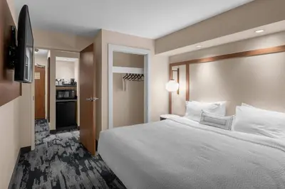 a hotel room with a large bed and a television at Fairfield by Marriott Inn & Suites Columbus Hilliard in Columbus