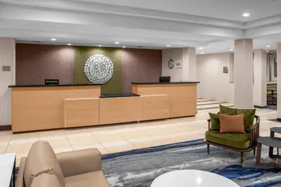 a lobby with a reception desk and a waiting room at Fairfield by Marriott Inn & Suites Columbus Hilliard in Columbus