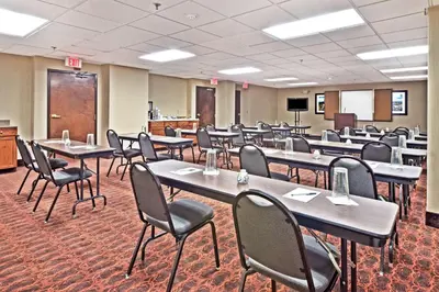 a classroom with tables and chairs in a room at Hampton Inn Huntington/Barboursville in Barboursville