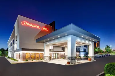 a hampton inn sign on the front of a building at Hampton Inn Cincinnati Airport-North in Hebron