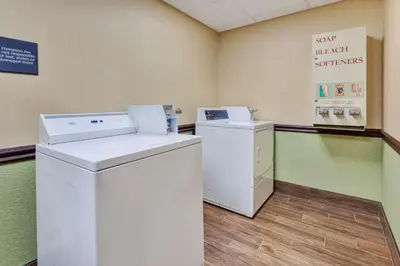 a laundry room with a washer and dryer at Hampton Inn Cincinnati Airport-North in Hebron