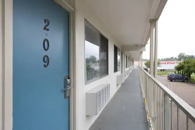 a blue door of a building with a hallway at Days Inn by Wyndham New Philadelphia in New Philadelphia