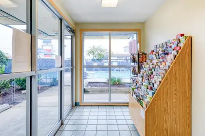 a shop with a window and a counter with books at Days Inn by Wyndham New Philadelphia in New Philadelphia