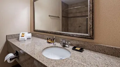 a bathroom with a sink and a mirror at Best Western Plus North Canton Inn & Suites in North Canton