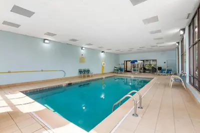 a swimming pool in a large room with a large at Comfort Inn, Cleveland South - Richfield in Richfield