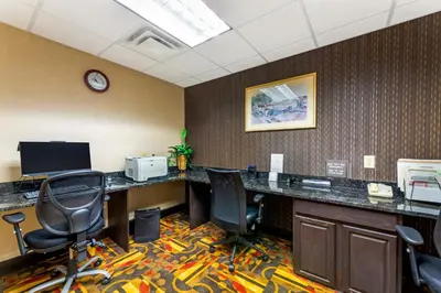 an office with a desk with chairs and a computer at Comfort Inn, Cleveland South - Richfield in Richfield