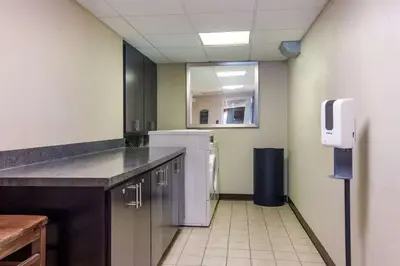 a kitchen with a refrigerator in a room at Best Western Dutch Valley Inn in New Philadelphia