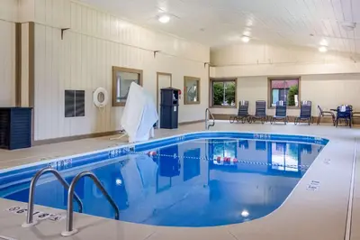a large swimming pool in a large room with a pool at Best Western Dutch Valley Inn in New Philadelphia