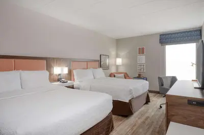 a hotel room with two beds and a window at Hampton Inn by Hilton Washington Court House in Jeffersonville