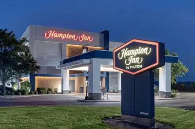 a hampton inn sign in front of a building at Hampton Inn by Hilton Washington Court House in Jeffersonville