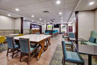 a dining room with a table and chairs at Hampton Inn & Suites Cleveland-Airport/Middleburg Heights in Middleburg Heights