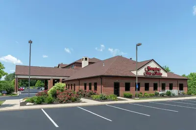a building with a parking lot in front of it at Hampton Inn & Suites Cleveland-Airport/Middleburg Heights in Middleburg Heights