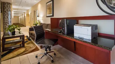 an office with a desk with a computer and a printer at Best Western Airport Inn & Suites Cleveland in Brook Park