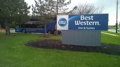 a sign that says best western in front of a bus at Best Western Airport Inn & Suites Cleveland in Brook Park