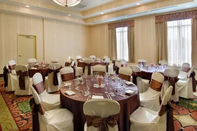 a conference room with tables and chairs in a room at Hilton Garden Inn Cleveland East / Mayfield Village in Mayfield