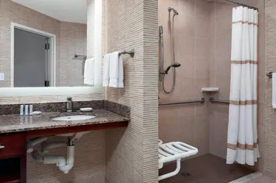 a bathroom with a sink and a shower at Residence Inn by Marriott Cincinnati Downtown/The Phelps in Cincinnati