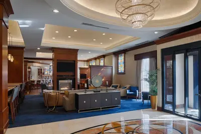 a hotel lobby with a waiting area with a tv at Residence Inn by Marriott Cincinnati Downtown/The Phelps in Cincinnati