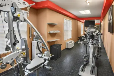 a fitness room with treadmills and exercise bikes at Country Inn & Suites by Radisson, Lexington, KY in Lexington