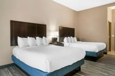 a hotel room with two large beds in it at Comfort Inn & Suites Toledo North in Toledo
