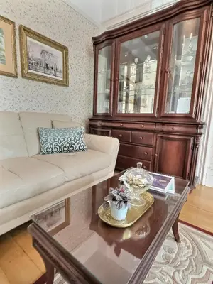 a living room with a couch and a coffee table at Historic Sion Bass Guest House in Fort Wayne