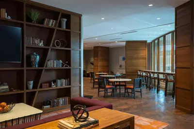 a room with tables and chairs and a library at Renaissance Columbus Westerville-Polaris Hotel in Westerville