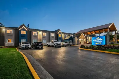 a parking lot in front of a motel at Microtel Inn by Wyndham Lexington in Lexington