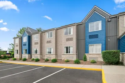 a row of houses in a parking lot at Microtel Inn by Wyndham Lexington in Lexington