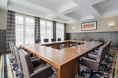 a large conference room with a long table and chairs at The Hancock Hotel in Findlay