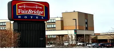 a sign for a fairbridge hotel in front of a building at Fairbridge Hotel Cleveland East in Wickliffe