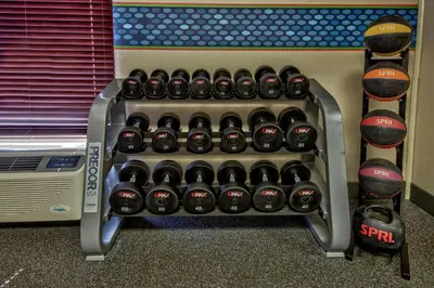 a rack of wine bottles next to a wall at Hampton Inn Ashland in Ashland