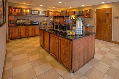 a kitchen with a counter with a coffee maker on it at Hampton Inn Wheeling in Wheeling